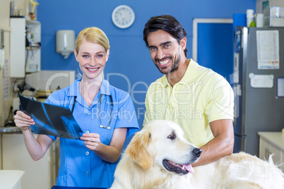 Woman vet and dogs owner smiling and posing