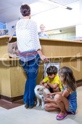 A woman vet talking with her customer