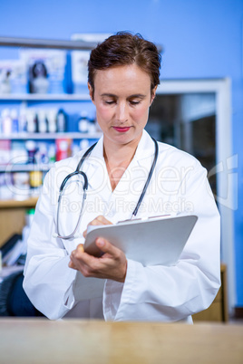 Portrait of woman taking notes