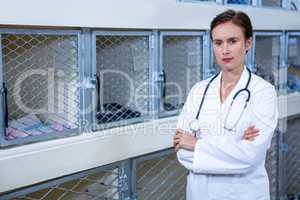 Portrait of woman vet standing with her arms crossed