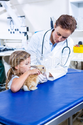 A women vet take of a rabbits