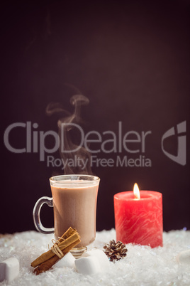 close up view of composite image of hot chocolate and candle