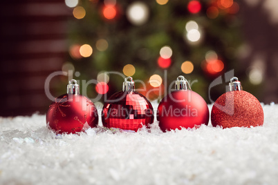 Composite image of Christmas baubles lined up