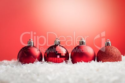 Composite image of Christmas baubles lined up
