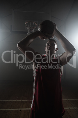 Portrait of basketball player trying to scoring