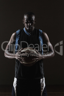 Portrait of basketball player holding a ball