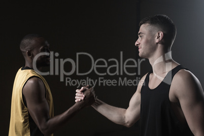 Portrait of basketball players shaking hands