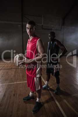 Portrait of two basketball players posing