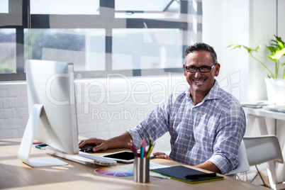 A business man working at computer desk