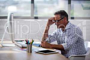 Side view of a businessman working at desk