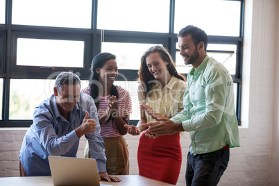 Portrait of business team laughing