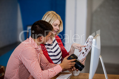 Side view of photographers working on photos