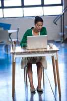 Attractive businesswoman working at computer desk