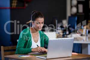 Close up view of attractive woman working at desk