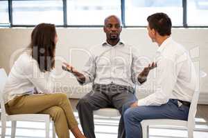 Business people having a discussion while sitting