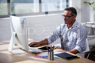 Businessman working at computer desk