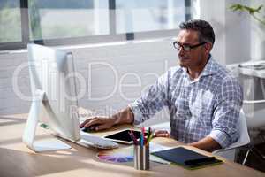 Businessman working at computer desk