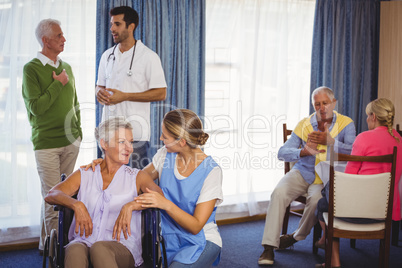 Nurses having discussions with seniors patients