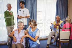 Nurses having discussions with seniors patients