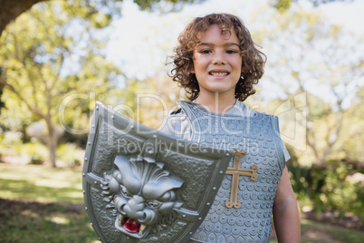 Portrait of a cute boy pretending to be a knight