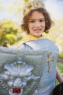 Portrait of a cute boy pretending to be a knight