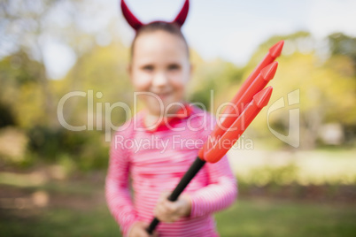 Blurred picture of a girl pretending to be a devil