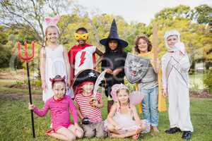 Children with fancy dress smiling and posing together
