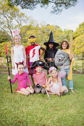 Children with fancy dress smiling and posing together