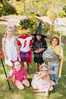 Children with fancy dress smiling and posing together