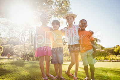 Children holding each other and posing