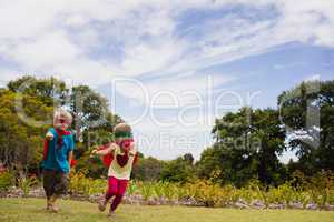 Children with superhero dress running and smiling