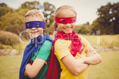 Portrait of children smiling and posing with crossed arms