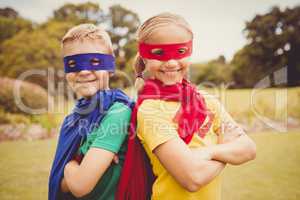 Portrait of children smiling and posing with crossed arms