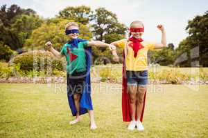 Children with superhero dress posing