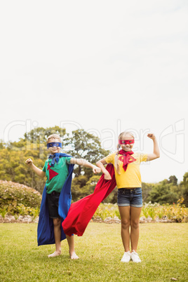 Children with superhero dress posing