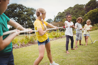 Children playing together with a rope