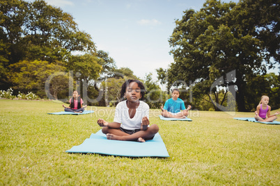 Group of children doing yoga