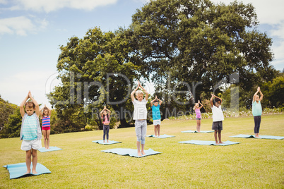 Group of children doing yoga