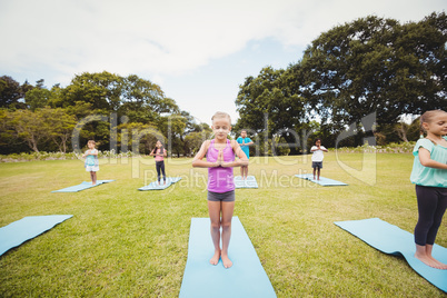 Group of children doing yoga