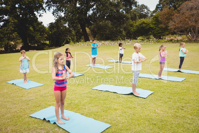 Group of children doing yoga