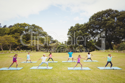 Group of children doing yoga