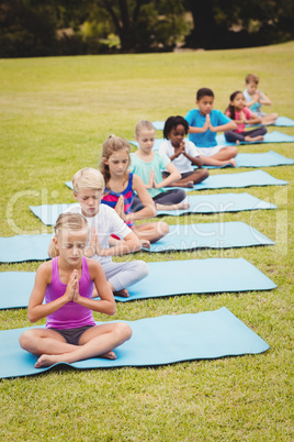 Group of children doing yoga