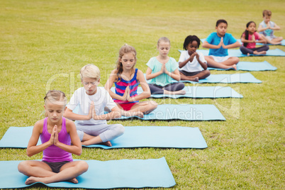 Group of children doing yoga