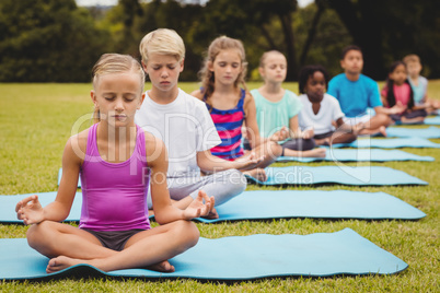 Group of children doing yoga