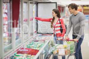 A young couple choosing products