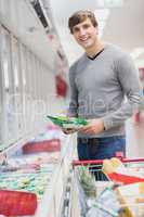 Man posing for the camera with product