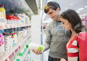 Profile view of couple doing grocery shopping