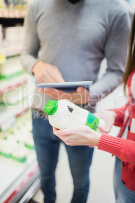 Close up view of couple doing grocery shopping together