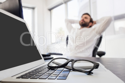 A businessman relaxing in his chair