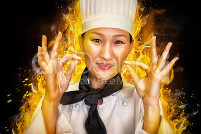 Composite image of closeup of a smiling female cook gesturing okay sign